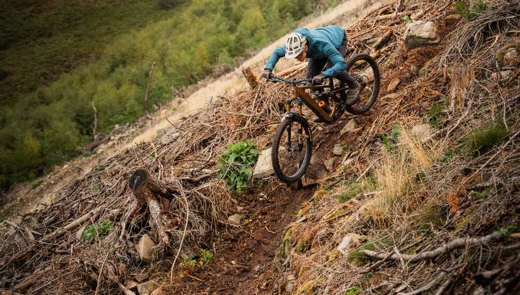 Riding a steep chute aboard the Ibis Oso HD